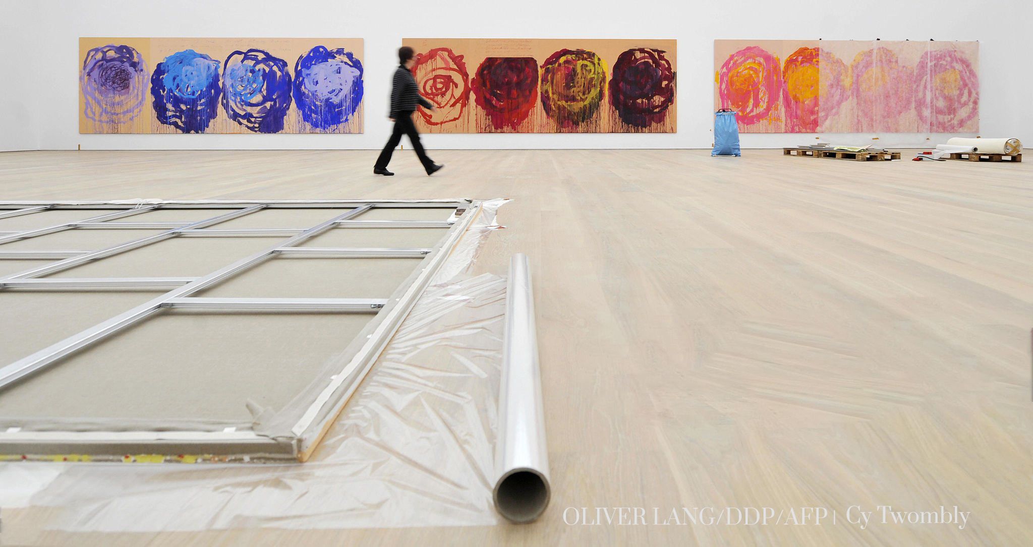 A visitor discovers a room in which paintings by US artist Cy Twombly